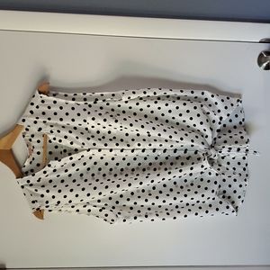 White and black polka dot notch collar blouse with tie waist detail, size L.